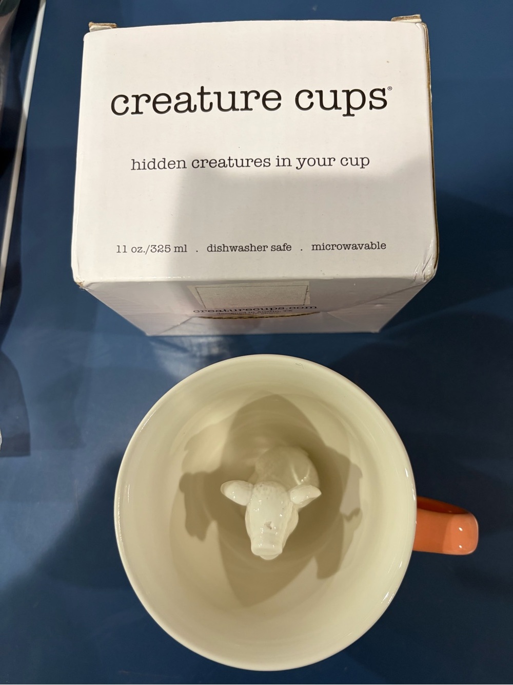 Creature Cup.  Hidden piglet in the bottom of your coffee cup.